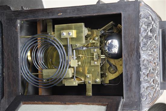 A late 19th century Maple & Co carved and ebonised oak chiming bracket clock, 23in., overall height 34in.